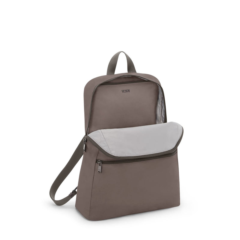 Mink TUMI backpack with a front pocket on a white background