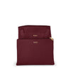 Wine TUMI pouch with gold zipper and logo on a white background