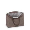 Mink TUMI tote bag with a gray interior on a white background