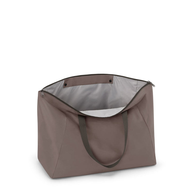 Mink TUMI tote bag with a gray interior on a white background