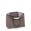 Mink TUMI tote bag with a gray interior on a white background