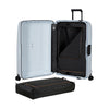 Open Samsonite suitcase with a black packing cube inside on a white background