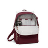Maroon TUMI backpack with white interior on a white background