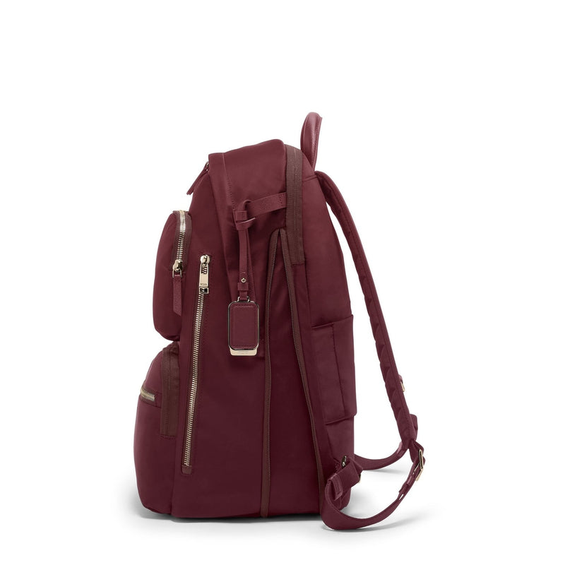 Maroon TUMI backpack on a white background