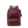 Maroon TUMI backpack with gold zippers on a white background