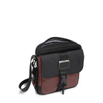 main compartment of oxblood TUMI Bravo Junior Crossbody