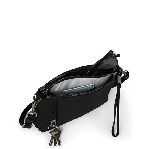 inside of black/gunmetal TUMI Voyageur Adela Crossbody