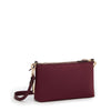 Wine TUMI handbag with gold zipper and strap on a white background