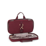 Open wine TUMI toiletry bag with interior compartments on a white background