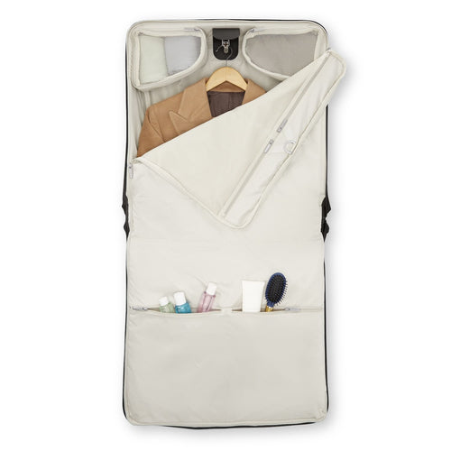 Samsonite suitcase with clothes and toiletries on a white background