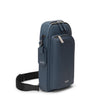 Blue TUMI shoulder bag with a strap on a white background
