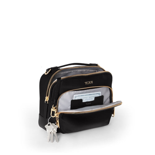 front pocket of black/gold TUMI Voyageur Teghan Crossbody