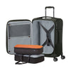 Climbing Ivy Samsonite suitcase with open compartment showing gray interior and orange packing cube on a white background