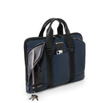 Blue TUMI briefcase with black accents on a white background