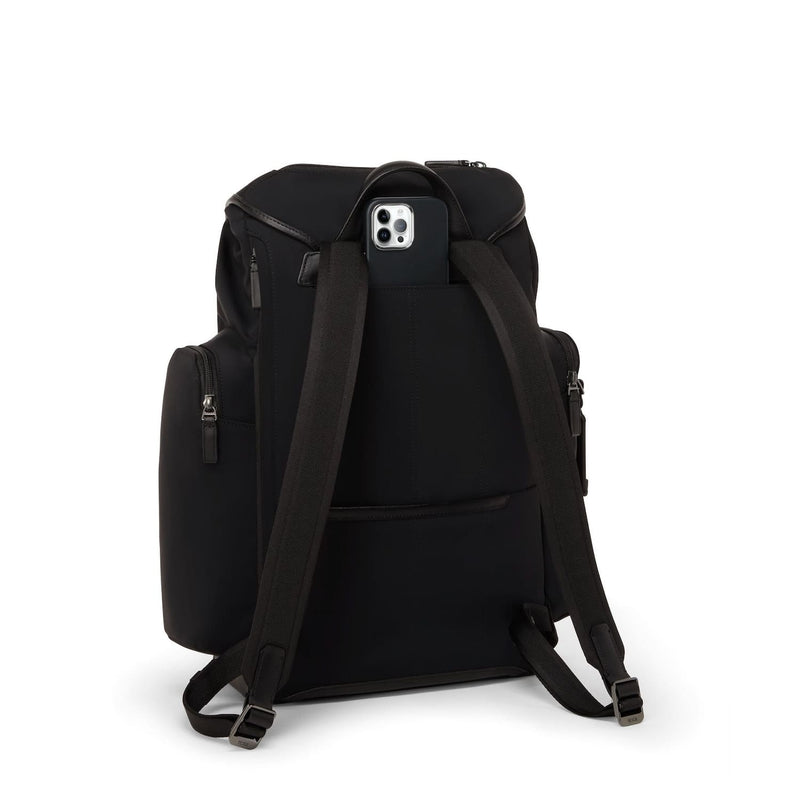 Black TUMI backpack with a phone pocket on a white background