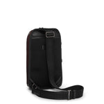 Black TUMI crossbody bag on a white background