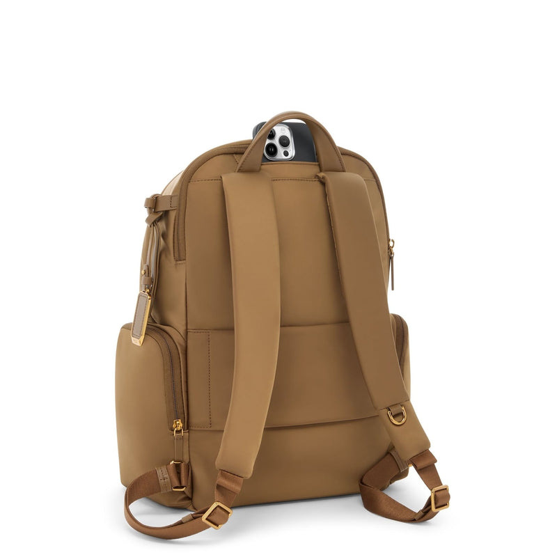 Copper TUMI backpack on a white background