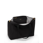 Black TUMI handbag with gold zippers on a white background