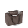 Mink TUMI tote bag with a visible brand logo on a white background