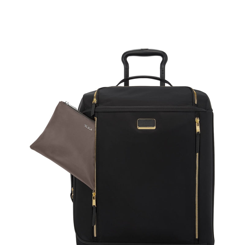 Black TUMI suitcase with a brown travel pouch on a white background