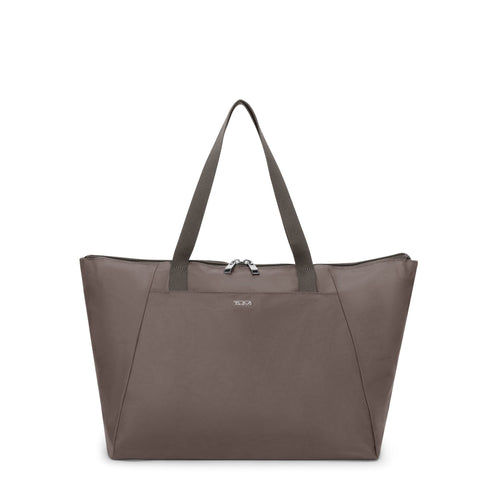 Mink TUMI tote bag with a visible brand logo on a white background