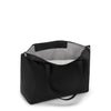 Black TUMI tote bag with a gray interior on a white background