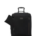 Black TUMI rolling suitcase with open front pocket on a white background