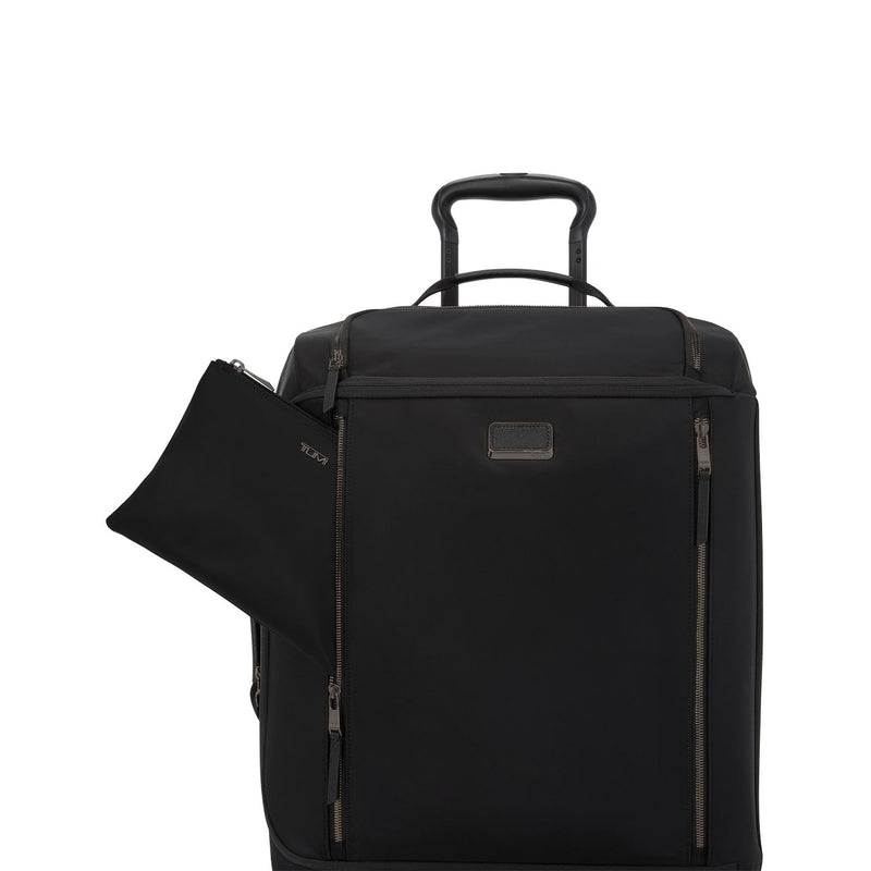 Black TUMI rolling suitcase with open front pocket on a white background