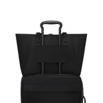 Black TUMI tote on a white background