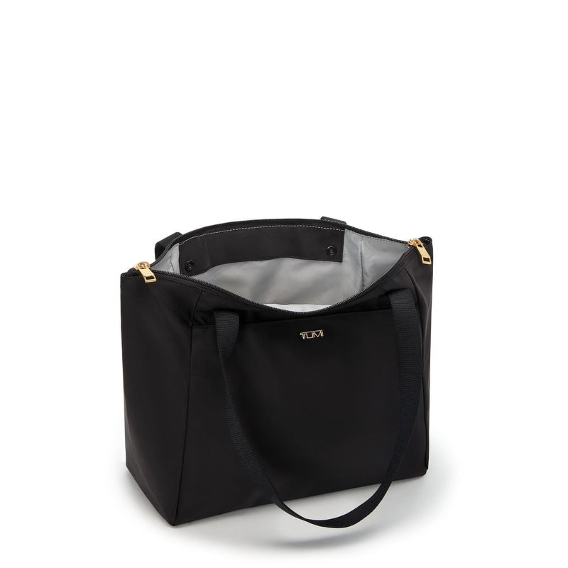 Black TUMI tote bag with gold accents on a white background