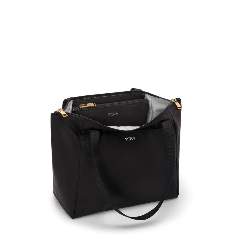 Black TUMI tote bag with gold accents on a white background