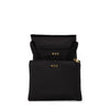 black TUMI pouch with gold zippers on a white background