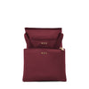 Wine TUMI bags with gold logo on a white background