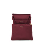 Wine TUMI bags with gold logo on a white background