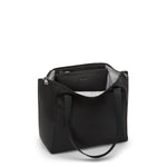 Black TUMI handbag with a visible brand logo on a white background