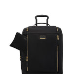 Black TUMI suitcase with gold zippers on a white background