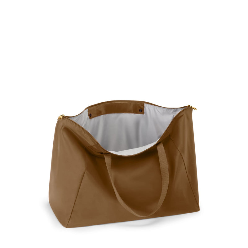 Copper TUMI tote bag on a white background
