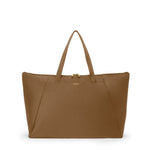 Copper TUMI tote bag with a visible brand logo on a white background