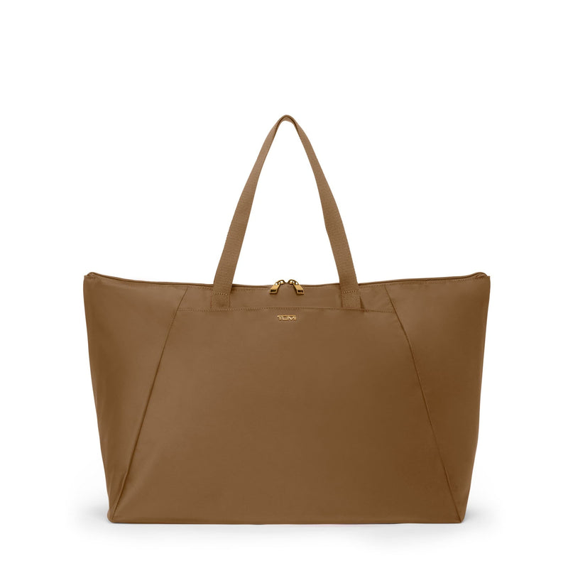 Copper TUMI tote bag with a visible brand logo on a white background