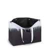 Black and white TUMI tote bag with gradient design on a white background