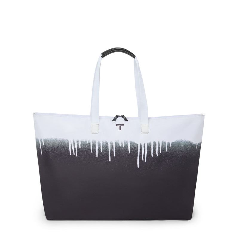 Black and white TUMI tote bag with a gradient design on a white background