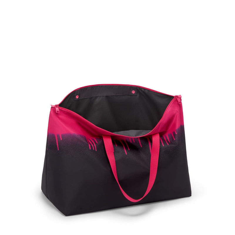Black and pink TUMI tote bag on a white background