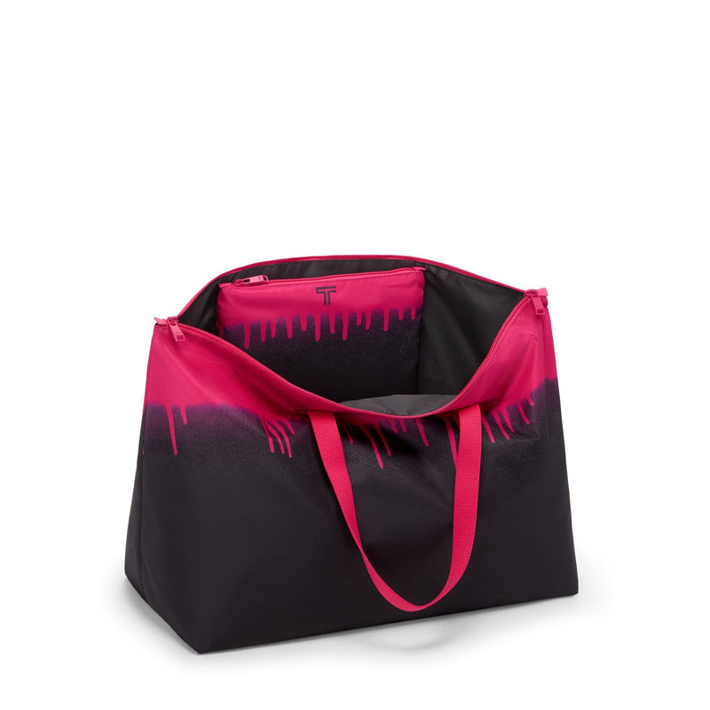 Black and pink TUMI tote bag with a gradient design on a white background