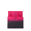 Pink and black TUMI tote bag with a gradient design on a white background