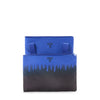 Blue and black TUMI gradient pouch with a brand logo on a white background