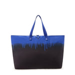 Blue and black TUMI tote bag with gradient design on a white background