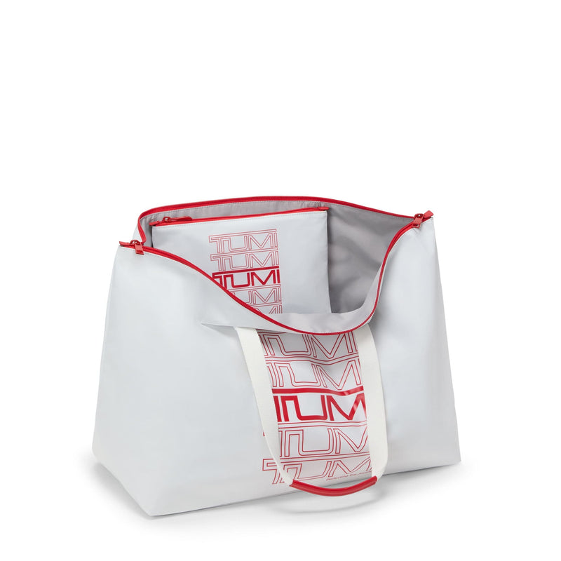 white and red TUMI tote bag on a white background