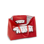 Red TUMI bag with cartoonish design on a white background