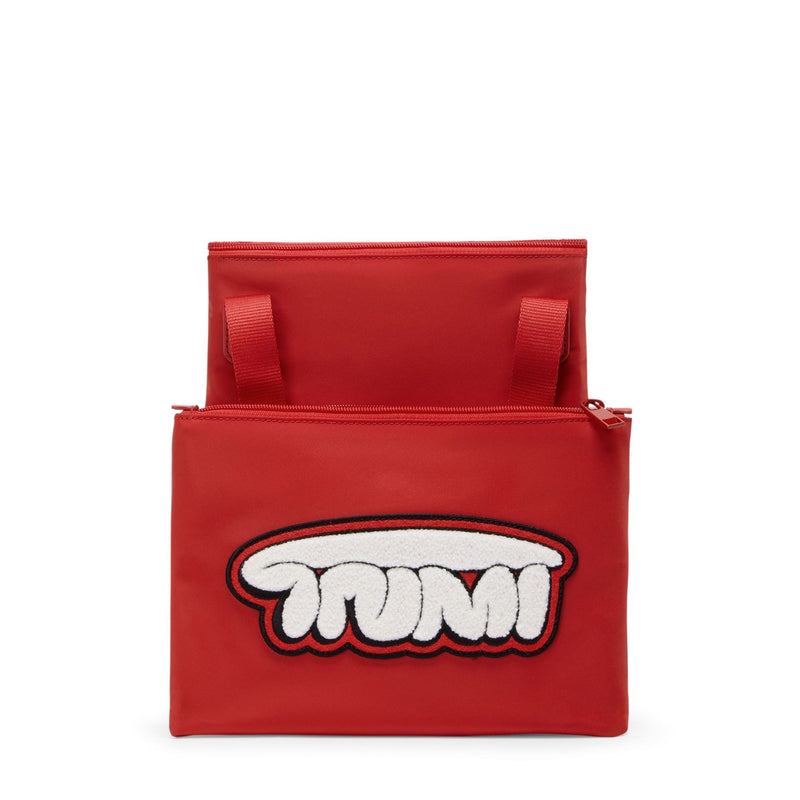 Red TUMI pouch with a white and black logo on a white background