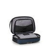 Open TUMI travel toiletry bag on a white background